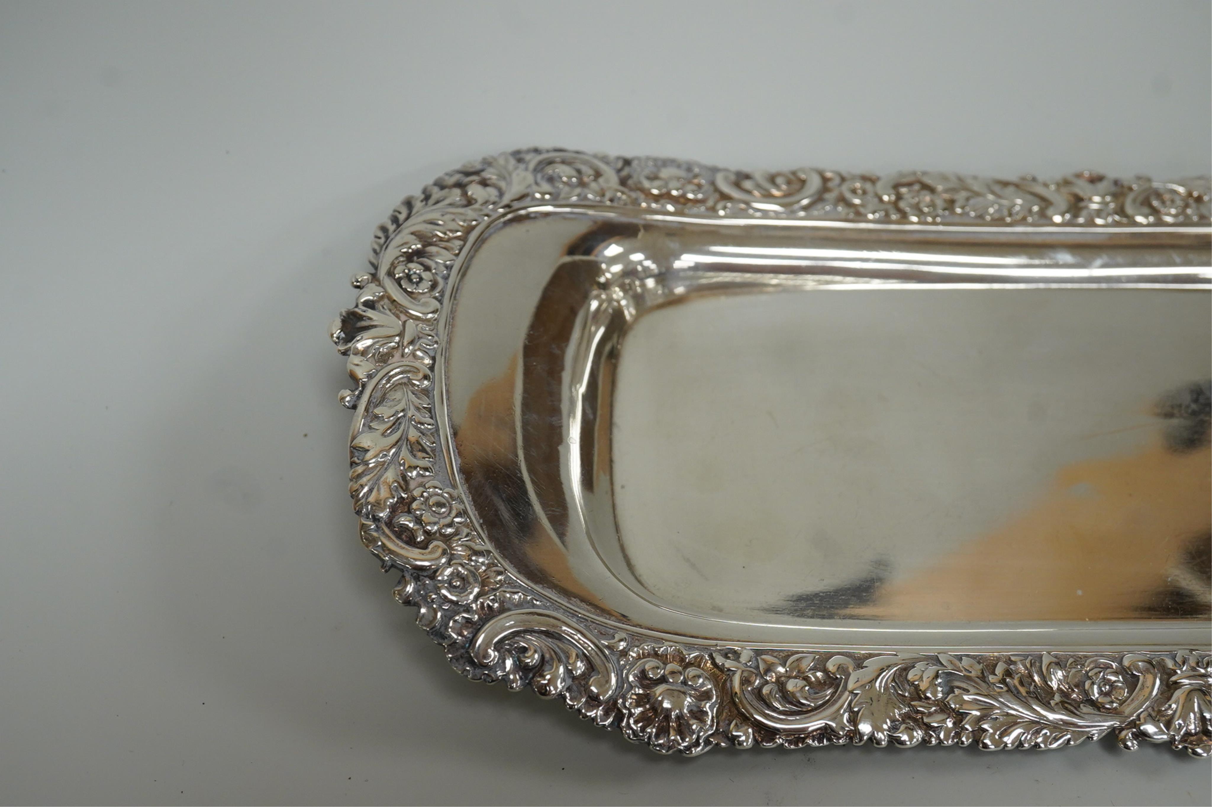 A late George III silver snuffers tray by Eames and Barnard, London, 1817, with foliate border, 26.2cm, 8.5oz.